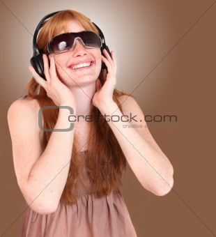 Redhead Listening to Music on Headphones