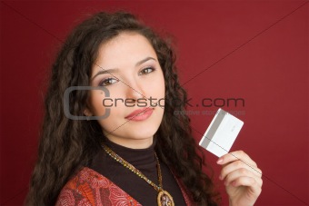 Young woman showing credit card