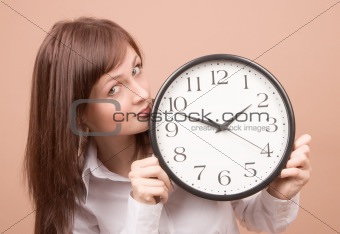 Young woman with clock 