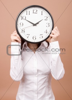 Young woman with clock