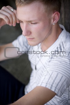 thinking male in white shirt