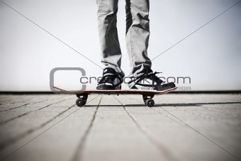 skater standing on his skateboard
