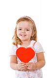Happy smiling little girl with red heart