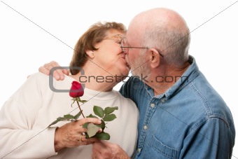 Happy Senior Couple with Red Rose Kissing Isolated on a White Background.