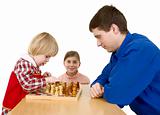 Man and childs play chess