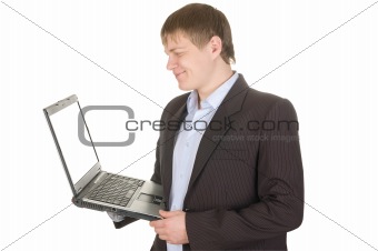 smiling businessman holding a laptop with white screen.