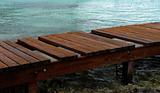 Weathered wooden pier to the ocean