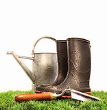 Garden boots with tool and watering can 