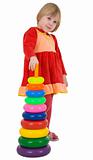 Little girl and plastic toy pyramid