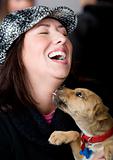 Hispanic woman with funny puppy
