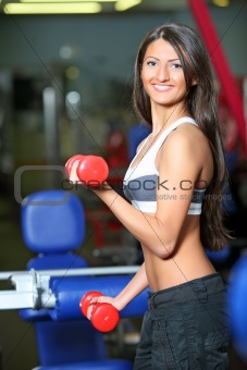 The girl with dumbbells 