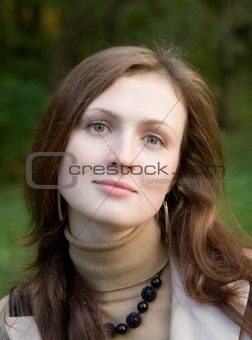 Young woman in the autumn park