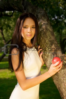 Beautiful girl holding a red apple