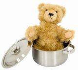 Toy brown bear in saucepan