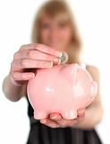 Woman saving money in a piggy Bank