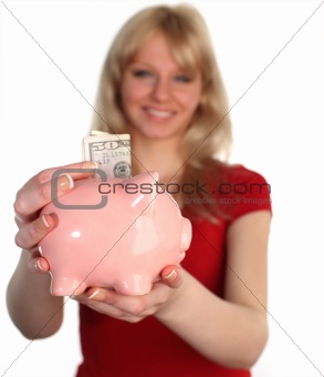 Woman holding out a piggy Bank