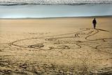 Woman Sand Painting Beach Walking to Water San Francisco Califor
