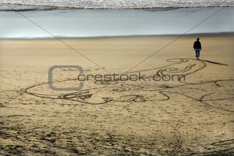 Woman Sand Painting Beach Walking to Water San Francisco Califor