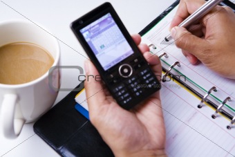 Writing schedule on organizer from phone cell