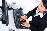 Young businesswoman working on computer