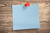 Blue paper note  on wood, clipping path.