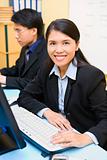 Woman employee is smiling in office