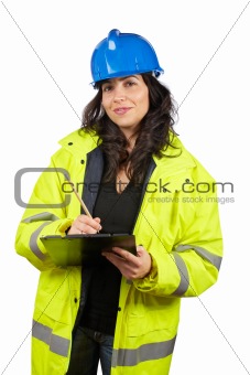 Female construction worker writing