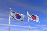 korea and japan flag in the wind