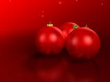 Red Christmas baubles on red stars background