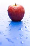 One wet red apple
