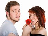 Young man with flower and pretty girl
