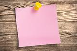 Pink paper note  on wood, clipping path.