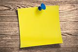 Yellow paper note  on wood, clipping path.