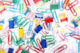 Multicolored paper clips and thumbtacks