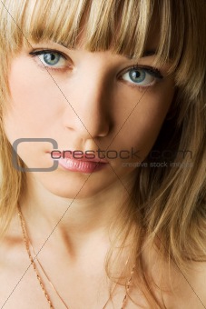 The beautiful young girl with blue eyes