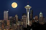 Summer full moon rising over the city of Seattle WA.