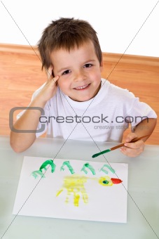 Boy painting with watercolors