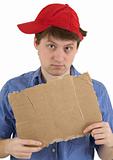 Man in red baseball cap and  tablet