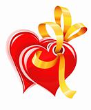 two red hearts with gold ribbon isolated
