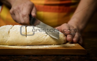 Adding cut to unbaked bread dough