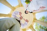 view from bottom to bride and groom