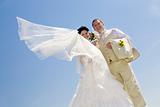 bride with flying viel and groom
