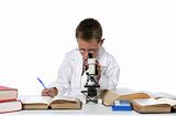 young  boy looking through microscope