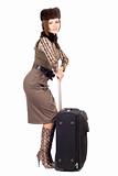 Young beautiful lady with a suitcase. Isolated 