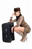 Young beautiful woman with a suitcase. Isolated