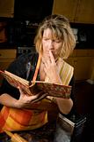 Harried woman with recipe book