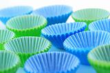Empty cupcake cups in green and blue