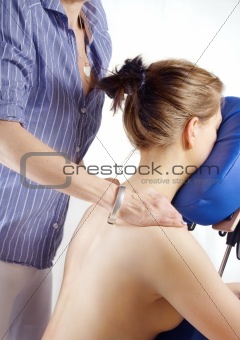 Woman gets massage on her shoulder