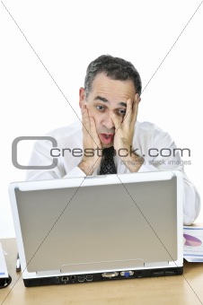 Businessman at his desk on white background