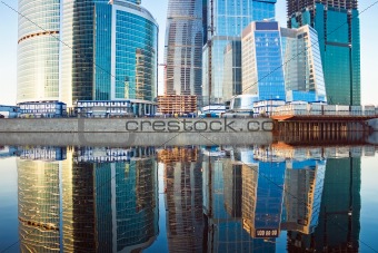 Skyscrapers at sunset and reflection